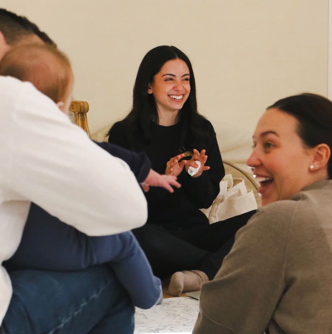 Jessica working with a family and baby during a therapy session